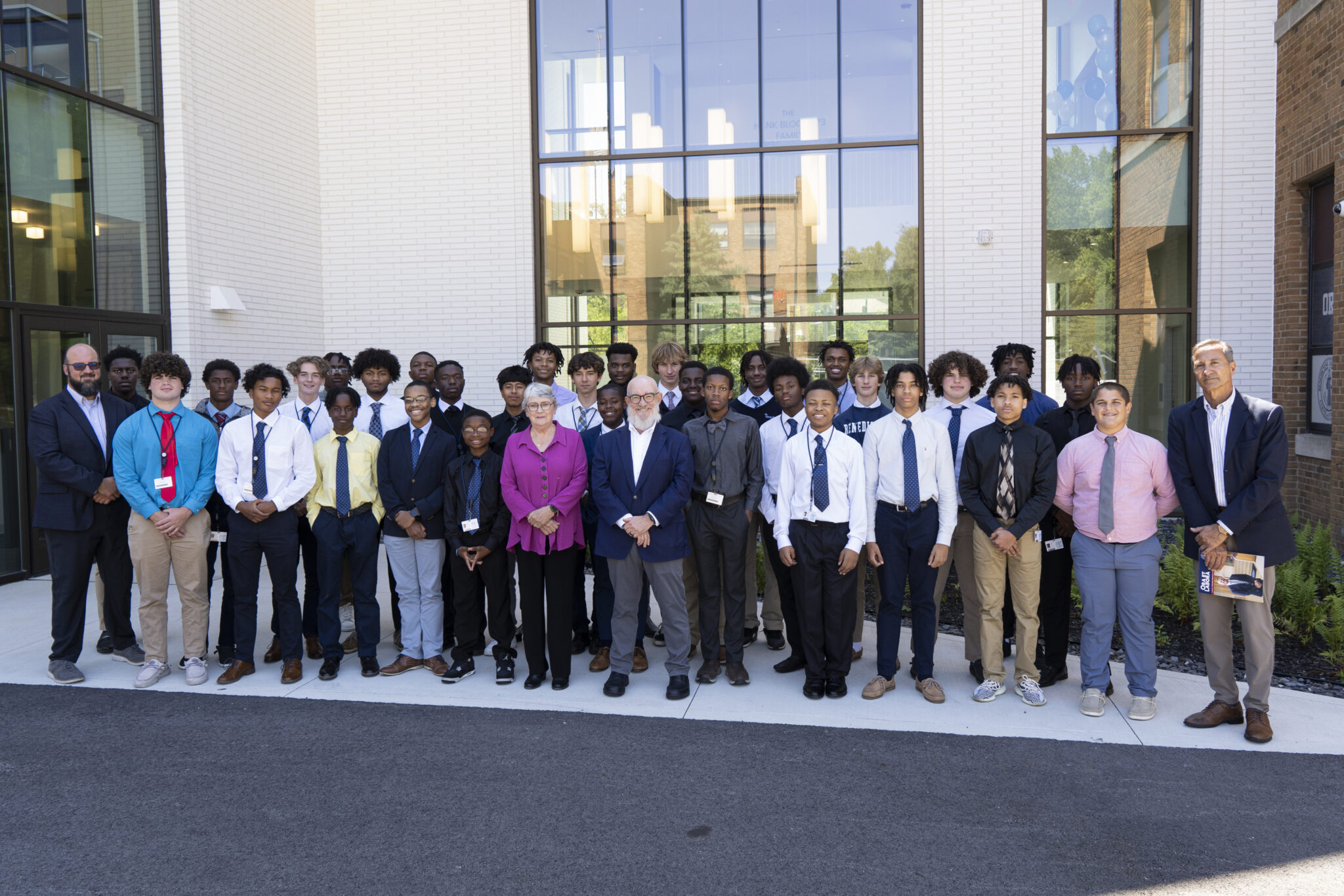 Benedictine High School students and school leadership gathered outside the entrance to the new Howley Science Wing at its ribbon-cutting ceremony.
